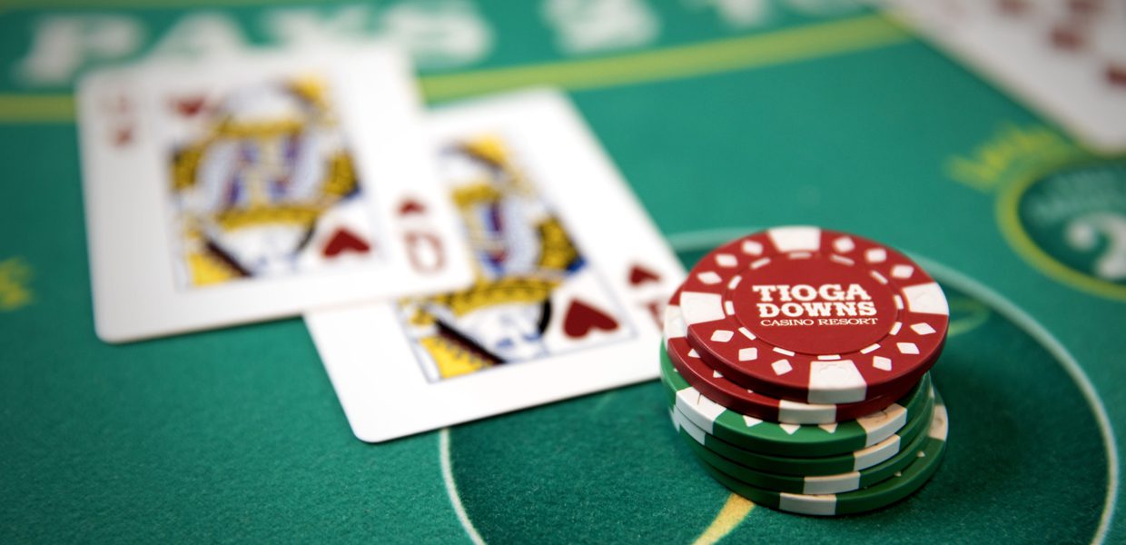 A close up of cards and chips on a table