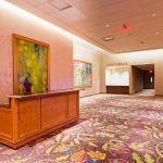 A large room with many different colored carpet.