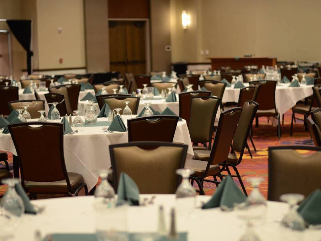 A room with many tables and chairs in it