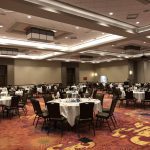 A large room with tables and chairs in it