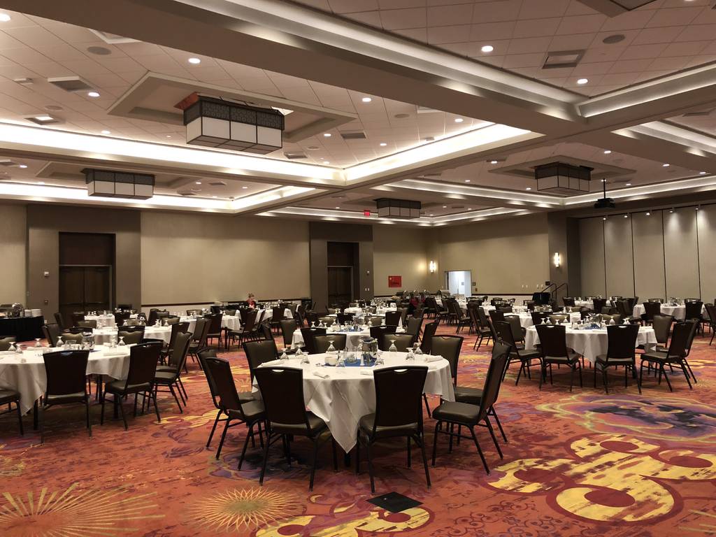 A large room with tables and chairs in it