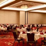 A room with many tables and chairs in it