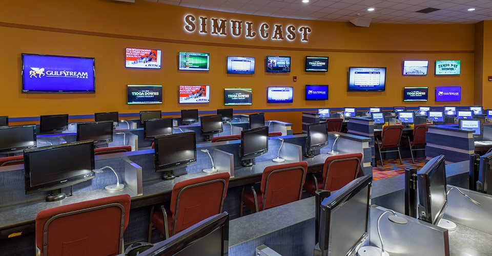 A room filled with lots of computers and chairs.