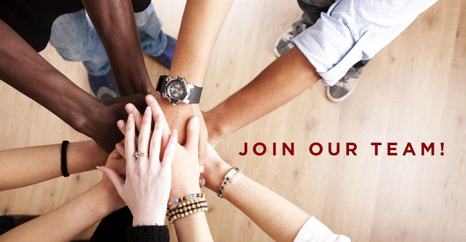 A group of people holding hands with the words " join our team ".