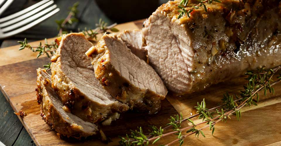 A close up of meat on top of a cutting board